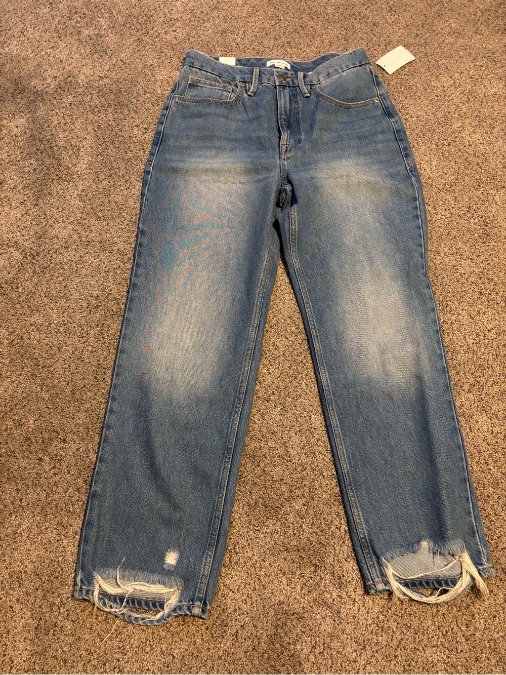 Good American Light Blue High-Rise Boyfriend Jeans with Distressed Hem